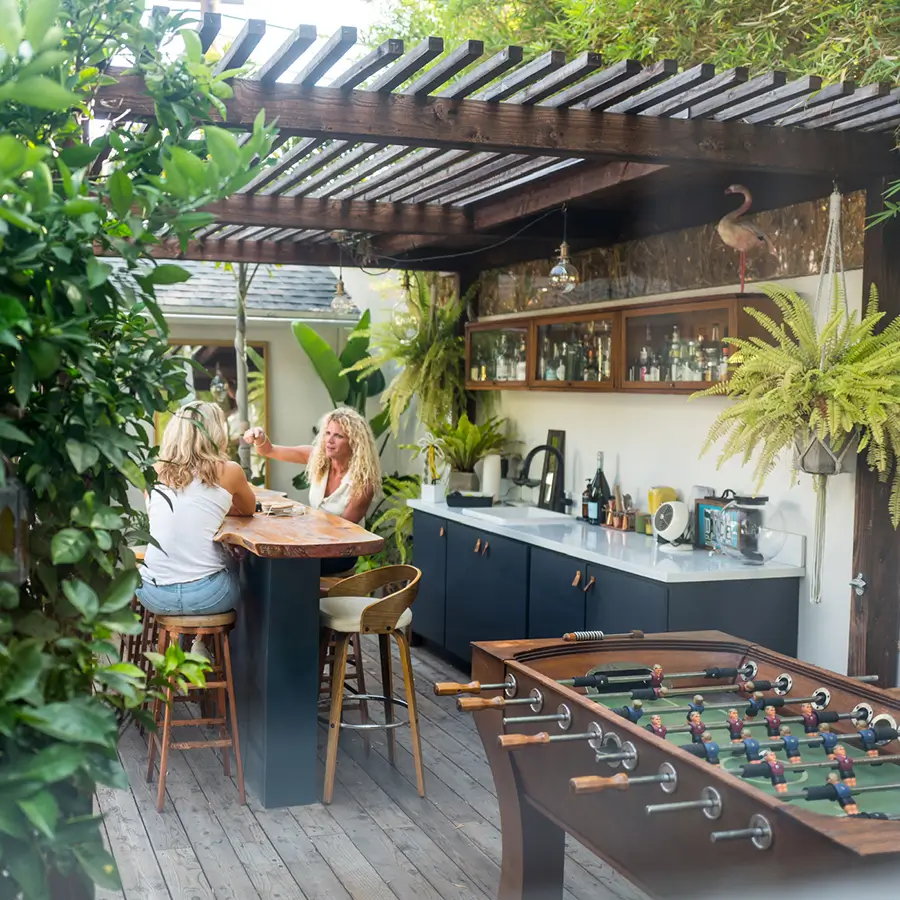A view of a modern exterior space designed with a mix of sophisticated, playful, and natural elements